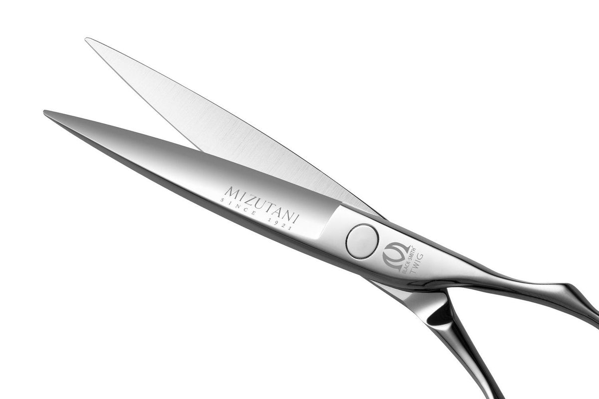 Close-up of Mizutani BLACK-SMITH Twig scissors, showcasing the 'cat's-eye' blade shape for strong, precise cutting