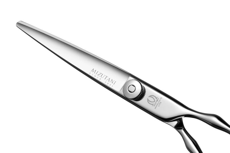 Close-up of Mizutani BLACK-SMITH Matelite-Q Lite scissors with their advanced ergonomic handle and smooth cutting blades.