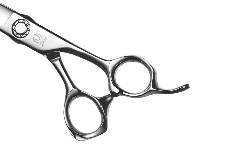 Close-up of Black-Smith Solid Scissors – A detailed close-up of the Mizutani Black-Smith Solid hair-cutting scissors, showcasing the sleek matte finish and ergonomic handle design.