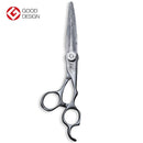 Close-up of Mizutani SWORD Dama scissors, featuring the distinctive Damascus steel pattern that is a result of a patented micro-powder fabrication process.