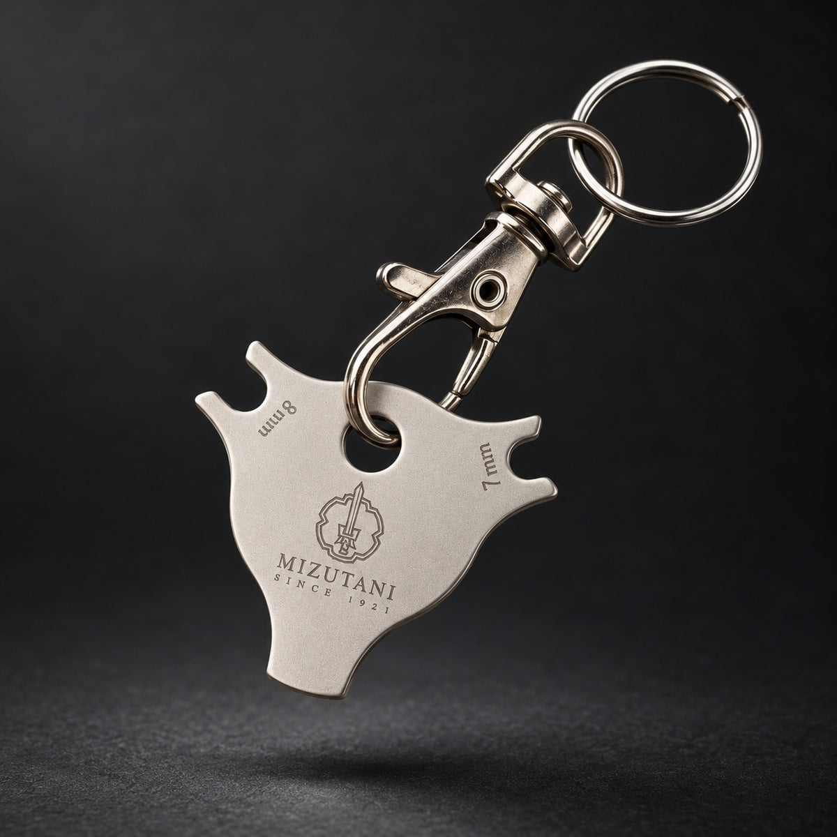 Mizutani scissors dial adjustment key with detachable swivel clasp and key ring, floating view